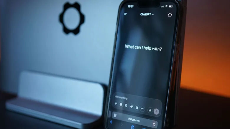 Close-up of a smartphone showing an AI chat interface