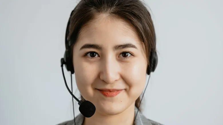 Smiling customer service representative wearing a headset